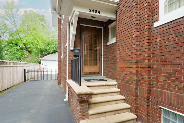 2454 Seneca Park Pl, Columbus, OH 43209 - property entrance with brick siding and a garage