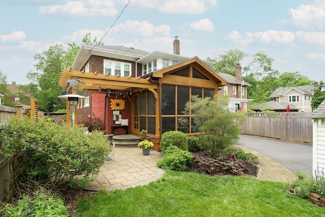 2454 Seneca Park Pl, Columbus, OH 43209 - back of house with a sunroom and a chimney