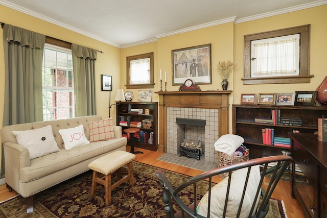 2454 Seneca Park Pl, Columbus, OH 43209 - living area with wood finished floors, a tile fireplace, and ornamental molding