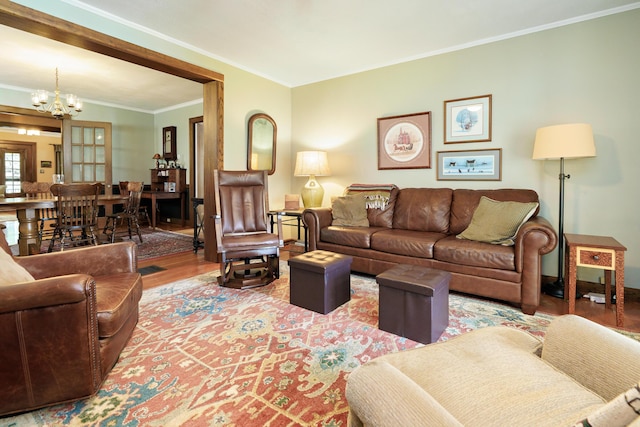 2454 Seneca Park Pl, Columbus, OH 43209 - living room with a chandelier, wood finished floors, and ornamental molding