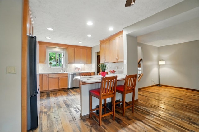 127 Saint Michelle St Unit 35B, Columbus, OH 43085 - kitchen featuring dishwasher, freestanding refrigerator, recessed lighting, a sink, and light countertops