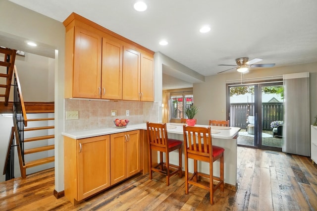 127 Saint Michelle St Unit 35B, Columbus, OH 43085 - kitchen with ceiling fan, light wood-style flooring, light countertops, a peninsula, and recessed lighting