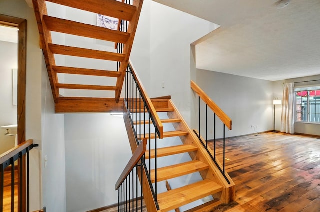 127 Saint Michelle St Unit 35B, Columbus, OH 43085 - stairway featuring hardwood / wood-style floors and baseboards