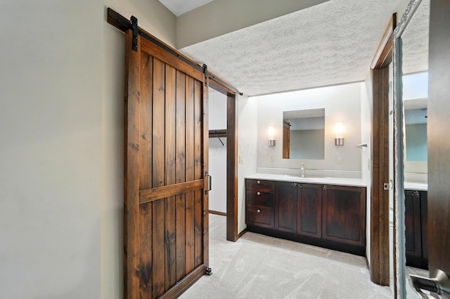 127 Saint Michelle St Unit 35B, Columbus, OH 43085 - bathroom with vanity and a textured ceiling