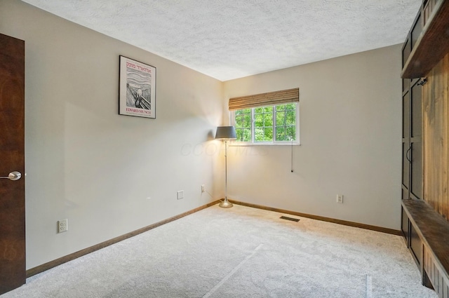 127 Saint Michelle St Unit 35B, Columbus, OH 43085 - unfurnished bedroom featuring carpet, baseboards, and a textured ceiling
