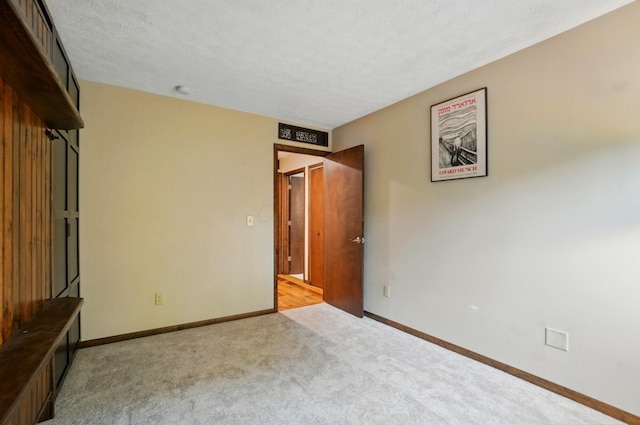 127 Saint Michelle St Unit 35B, Columbus, OH 43085 - unfurnished room with light carpet, baseboards, and a textured ceiling