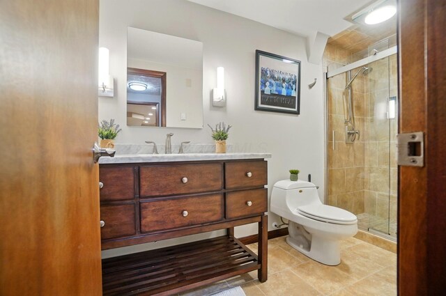 127 Saint Michelle St Unit 35B, Columbus, OH 43085 - bathroom featuring toilet, vanity, a stall shower, and tile patterned flooring