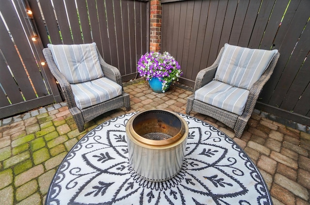 127 Saint Michelle St Unit 35B, Columbus, OH 43085 - view of patio / terrace with an outdoor fire pit