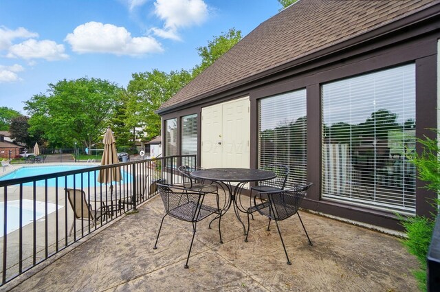 127 Saint Michelle St Unit 35B, Columbus, OH 43085 - balcony with a patio, view of pool area, and outdoor dining space