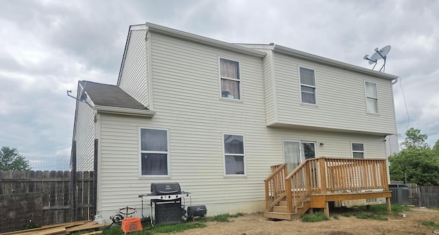2525 Dexham Ct, Columbus, OH 43224 - rear view of property with fence, a deck, and central air condition unit