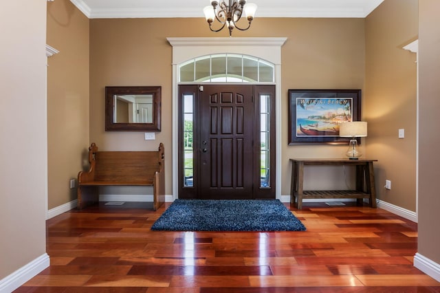 2036 Amber Wood Pl, Lancaster, OH 43130 - foyer entrance featuring a chandelier, wood finished floors, baseboards, and crown molding