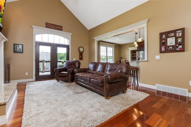 2036 Amber Wood Pl, Lancaster, OH 43130 - living area featuring wood finished floors, high vaulted ceiling, french doors, and baseboards