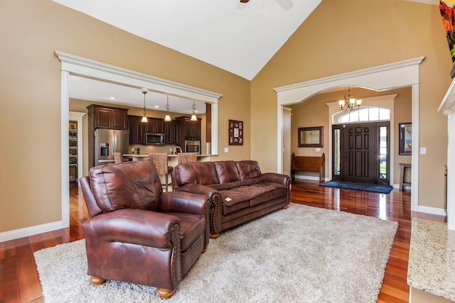 2036 Amber Wood Pl, Lancaster, OH 43130 - living room featuring light wood-style flooring, a ceiling fan, high vaulted ceiling, and a chandelier