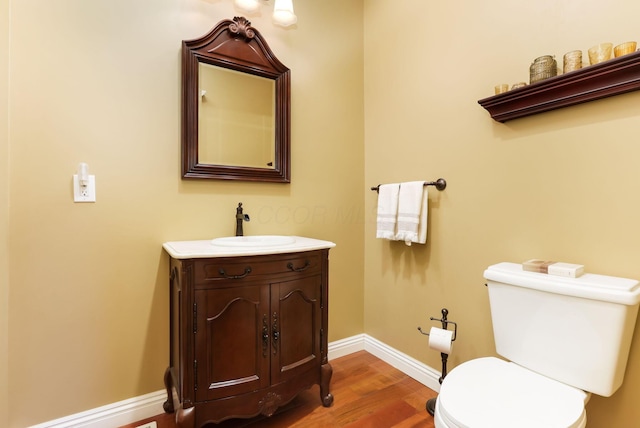2036 Amber Wood Pl, Lancaster, OH 43130 - half bath with toilet, vanity, wood finished floors, and baseboards