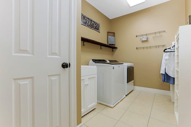 2036 Amber Wood Pl, Lancaster, OH 43130 - laundry area with washer and clothes dryer, light tile patterned floors, and baseboards