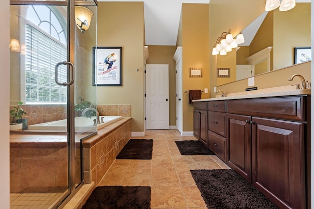 2036 Amber Wood Pl, Lancaster, OH 43130 - bathroom with double vanity, a garden tub, a shower stall, baseboards, and tile patterned flooring