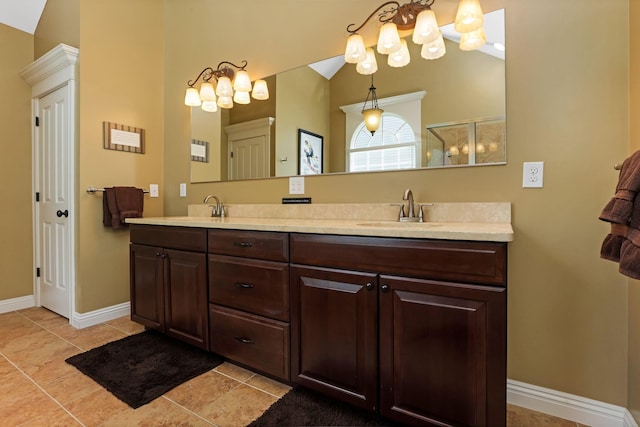 2036 Amber Wood Pl, Lancaster, OH 43130 - full bath featuring double vanity, a chandelier, baseboards, tile patterned floors, and vaulted ceiling