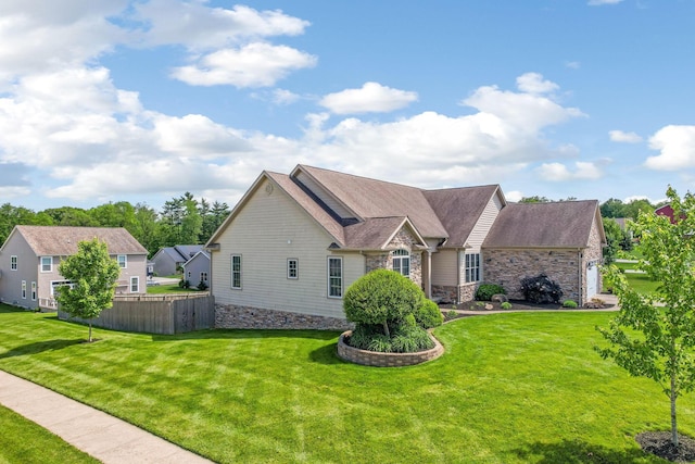 2036 Amber Wood Pl, Lancaster, OH 43130 - view of front of property featuring stone siding, an attached garage, and roof with shingles