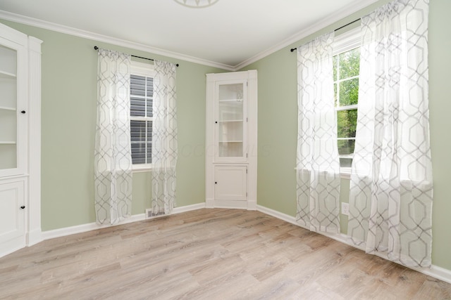162 E Morrill Ave, Columbus, OH 43207 - spare room with wood finished floors, crown molding, and baseboards