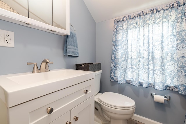 162 E Morrill Ave, Columbus, OH 43207 - bathroom with vaulted ceiling, toilet, and vanity
