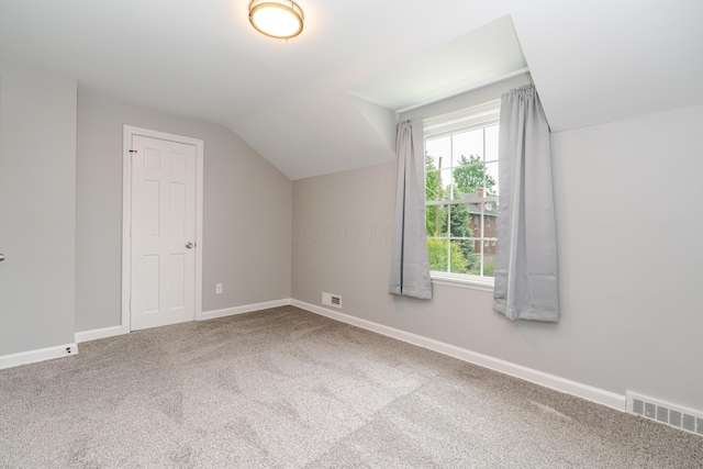 162 E Morrill Ave, Columbus, OH 43207 - additional living space with vaulted ceiling, carpet floors, and baseboards