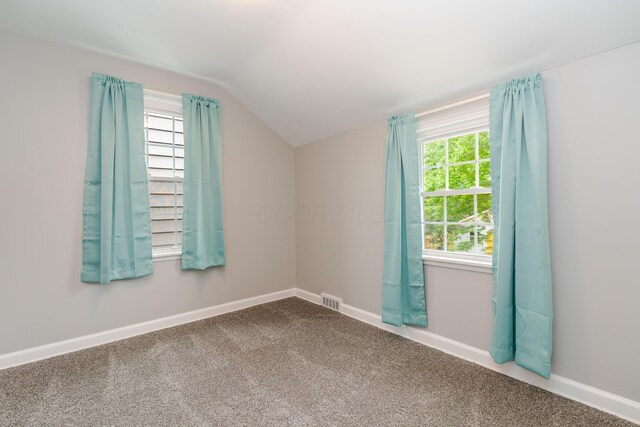 162 E Morrill Ave, Columbus, OH 43207 - carpeted spare room featuring lofted ceiling, plenty of natural light, and baseboards