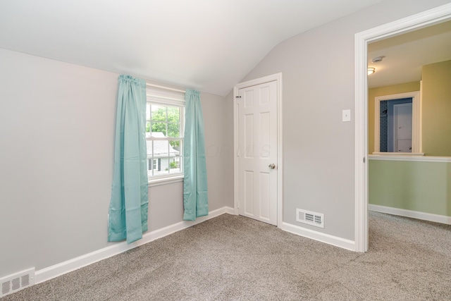 162 E Morrill Ave, Columbus, OH 43207 - unfurnished bedroom featuring vaulted ceiling, carpet floors, and baseboards