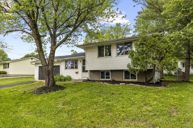 1530 Lexdale Dr, Reynoldsburg, OH 43068 - split level home with a garage, a front lawn, and driveway
