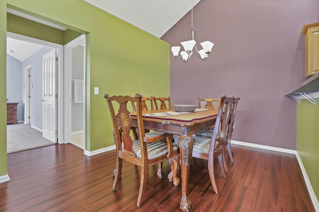 6542 Lakeview Cir, Canal Winchester, OH 43110 - dining room featuring a chandelier, baseboards, wood finished floors, and high vaulted ceiling