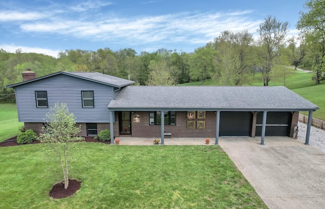 699 Cedar Run Rd NE, Newark, OH 43055 - tri-level home with concrete driveway, brick siding, a front lawn, roof with shingles, and a garage