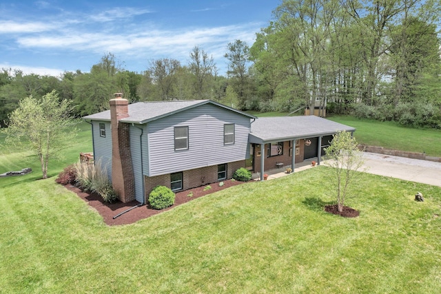 699 Cedar Run Rd NE, Newark, OH 43055 - split level home featuring a chimney, driveway, a front yard, and a porch