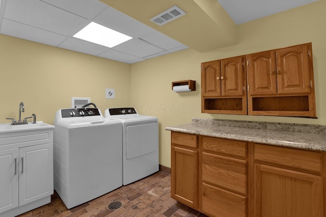 699 Cedar Run Rd NE, Newark, OH 43055 - laundry area with cabinet space and separate washer and dryer