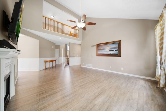 272 Trail E, Etna, OH 43062 - unfurnished living room featuring wood finished floors, ceiling fan, a fireplace, and high vaulted ceiling