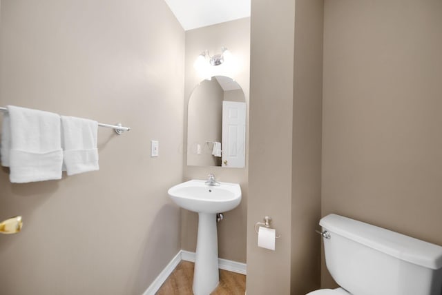 272 Trail E, Etna, OH 43062 - bathroom featuring toilet, baseboards, wood finished floors, and a sink
