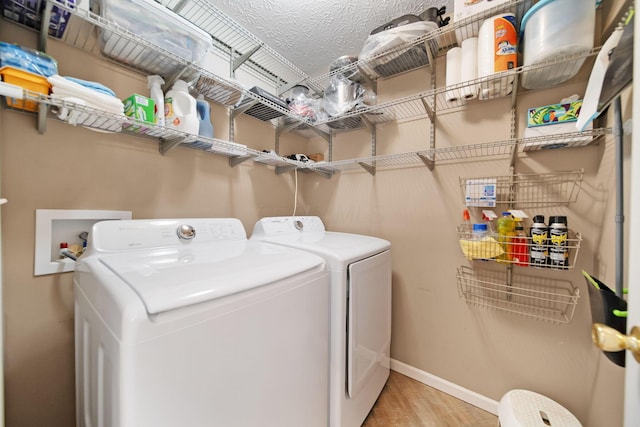 272 Trail E, Etna, OH 43062 - laundry area with washer and dryer, baseboards, and light wood-type flooring