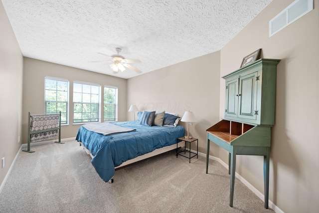 272 Trail E, Etna, OH 43062 - bedroom with light carpet, a textured ceiling, baseboards, and ceiling fan
