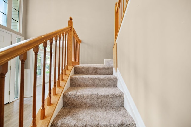 272 Trail E, Etna, OH 43062 - stairway with healthy amount of natural light, wood finished floors, and a towering ceiling