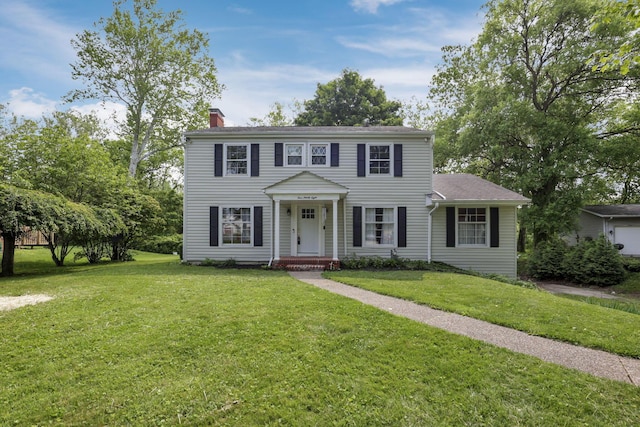 498 Manor, Newark, OH 43055 - colonial-style house featuring a chimney and a front lawn