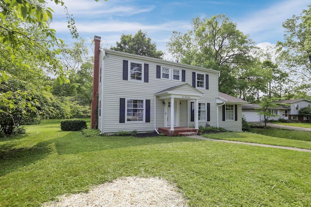 498 Manor, Newark, OH 43055 - view of front of property featuring a chimney and a front lawn