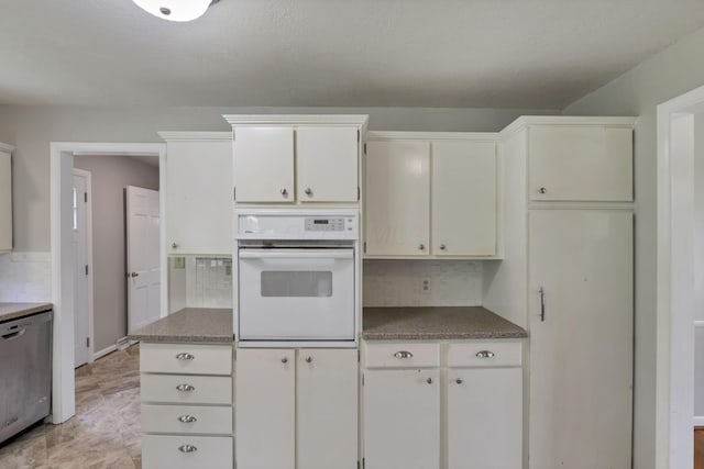 498 Manor, Newark, OH 43055 - kitchen featuring white oven, dishwasher, decorative backsplash, white cabinetry, and dark countertops