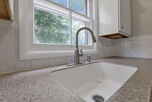 498 Manor, Newark, OH 43055 - kitchen view of a sink, tasteful backsplash, and light stone countertops