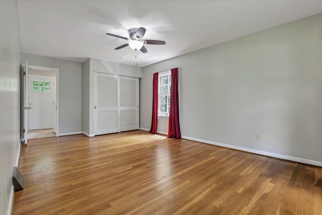 498 Manor, Newark, OH 43055 - unfurnished bedroom featuring wood finished floors, baseboards, a closet, and a ceiling fan