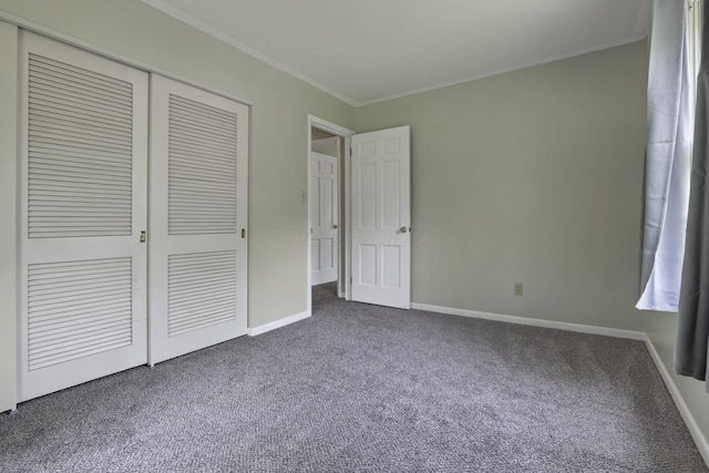 498 Manor, Newark, OH 43055 - unfurnished bedroom with dark carpet, a closet, ornamental molding, and baseboards