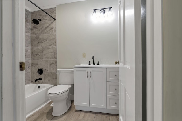 498 Manor, Newark, OH 43055 - bathroom with toilet, vanity, wood finished floors, and tub / shower combination