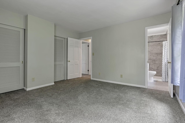 498 Manor, Newark, OH 43055 - unfurnished bedroom with carpet, baseboards, connected bathroom, and multiple closets