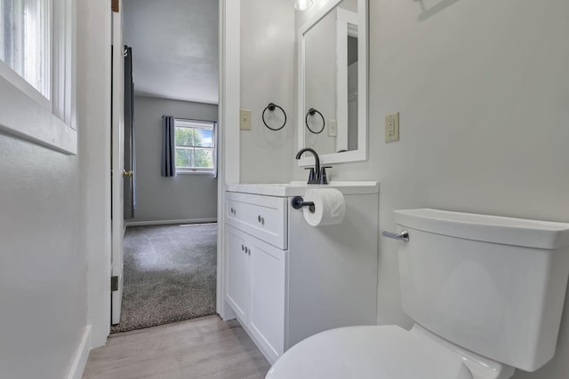 498 Manor, Newark, OH 43055 - bathroom featuring toilet, vanity, wood finished floors, and baseboards