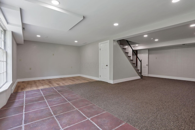 498 Manor, Newark, OH 43055 - basement featuring stairway, baseboards, recessed lighting, tile patterned floors, and carpet