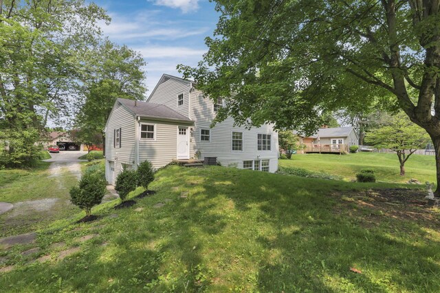 498 Manor, Newark, OH 43055 - back of house featuring a lawn and central AC