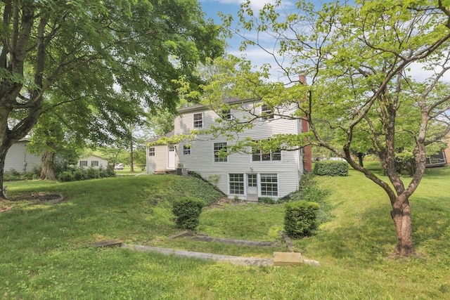 498 Manor, Newark, OH 43055 - rear view of property featuring a chimney and a lawn