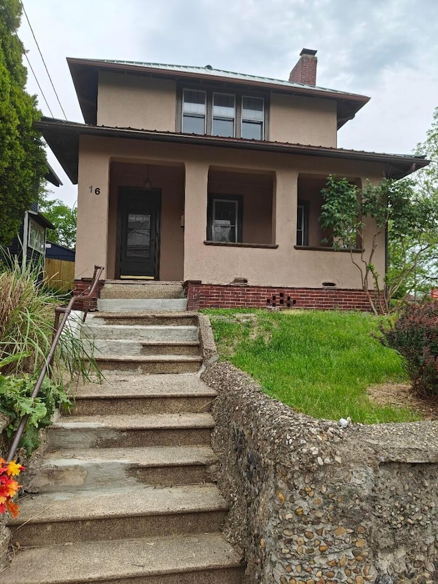 16 N 7th St, Newark, OH 43055 - view of front of property featuring stucco siding, a chimney, and covered porch
